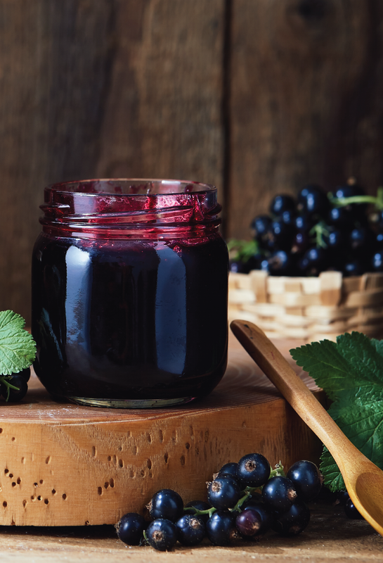 Container of black currant jam